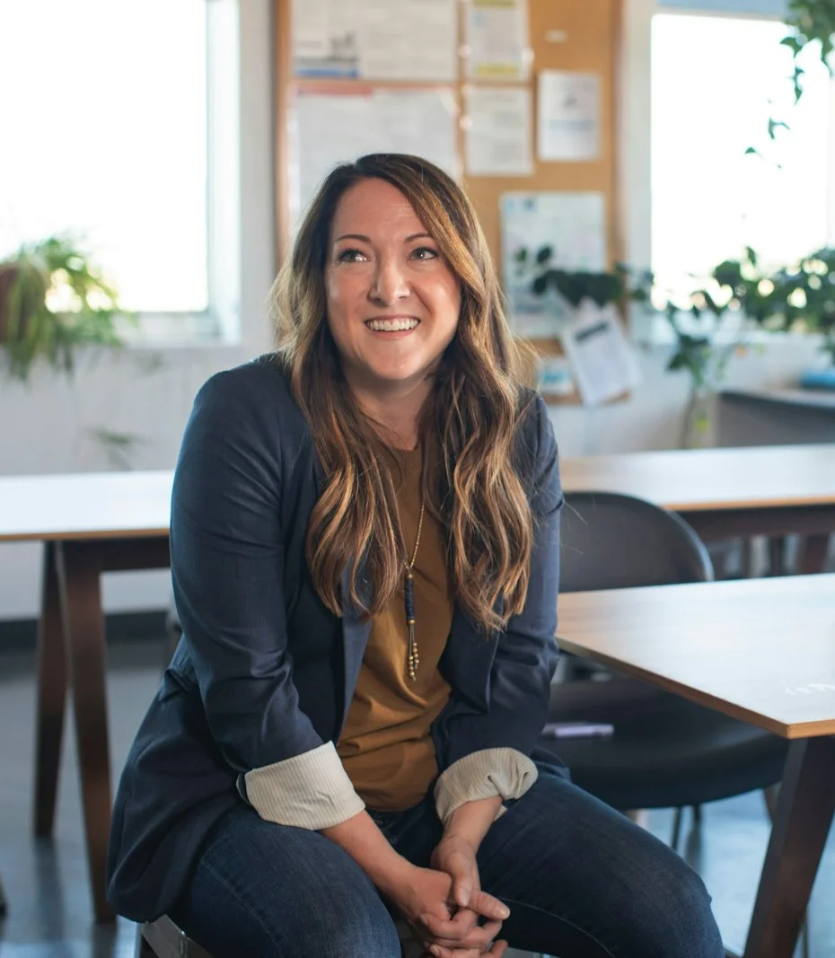 Hannah Price sitting relaxed in the Elmwood office
