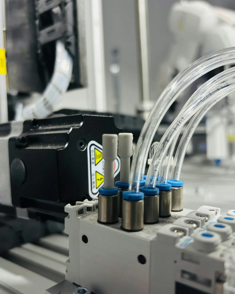 Pneumatic valves and air lines on a gripper being built