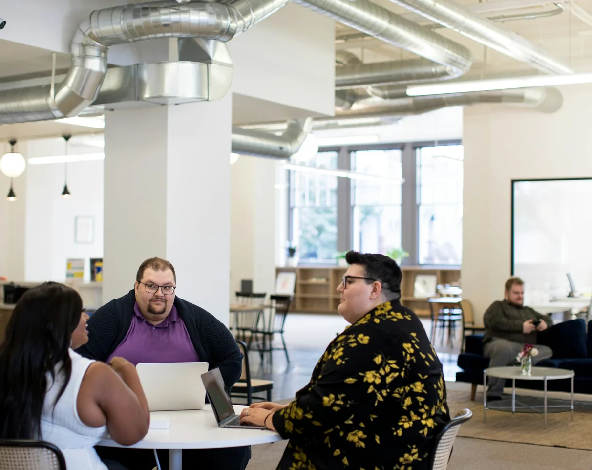 A grid-storage startup's team planning their launch around a table