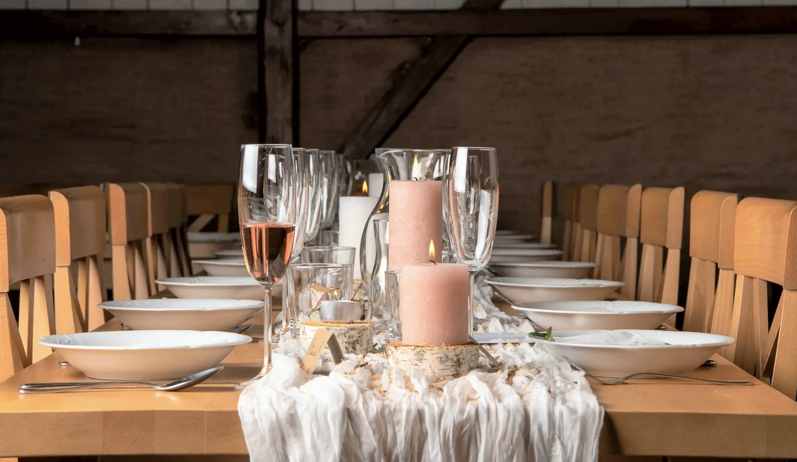 The chef's table: one long table laid for ten under the old beams, candles not yet lit