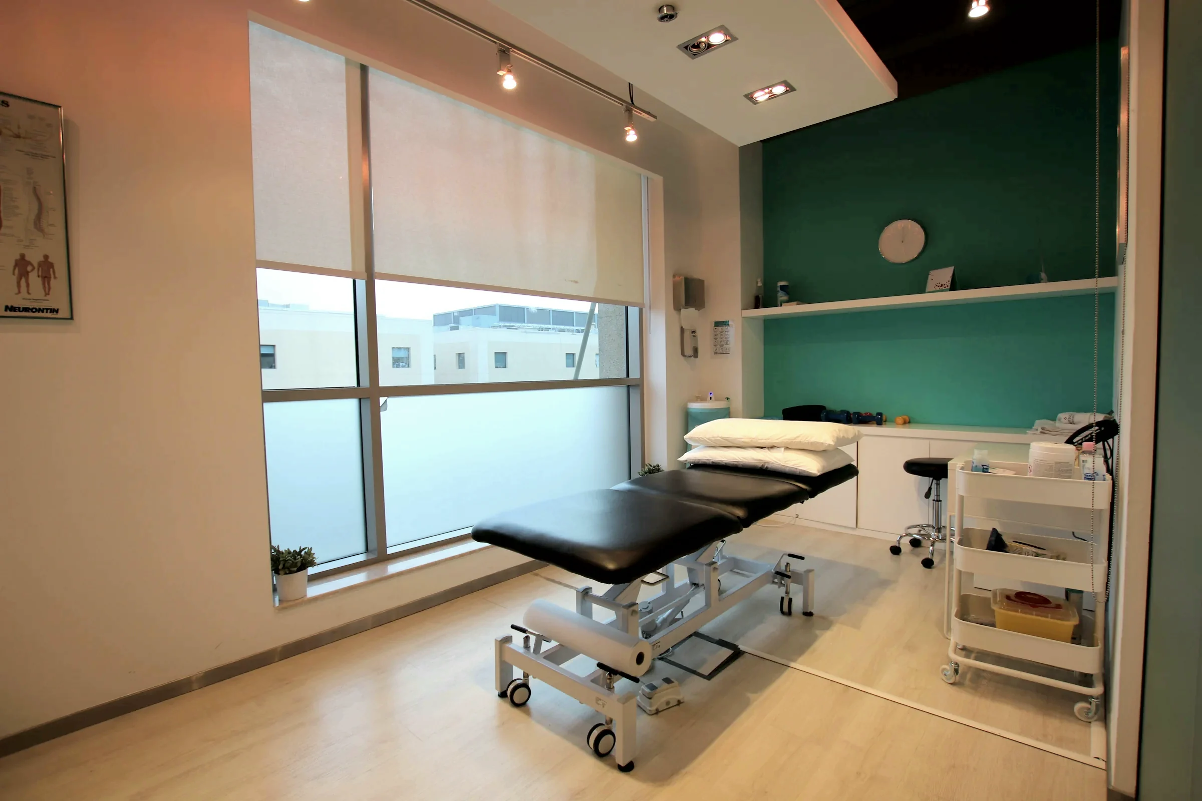 A treatment room at Northline with a table beside a tall window
