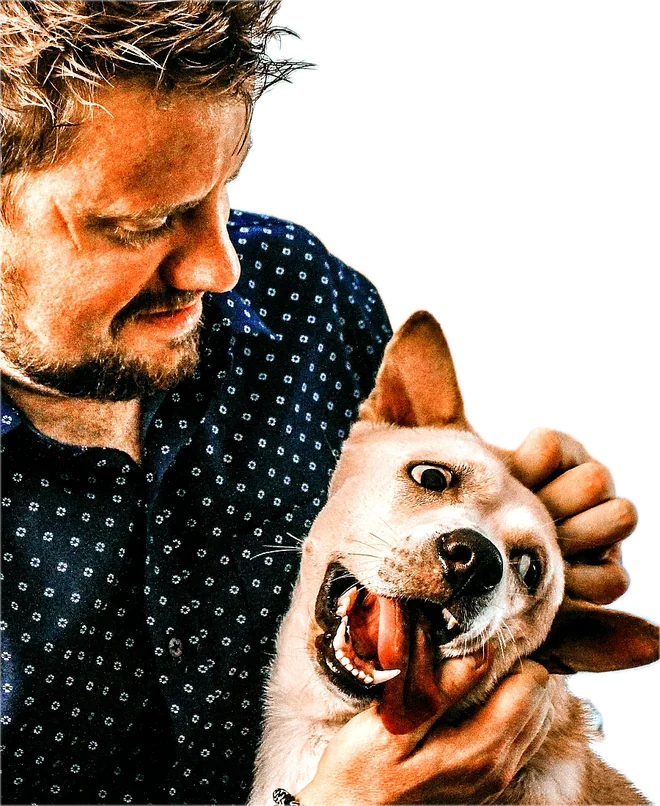 Leo Brandt giving a happy dog a scratch behind the ears